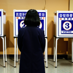 **

A shadowy figure representing Shincheonji subtly manipulating voting ballots in a polling station. Emphasize the clandestine nature of the activity. The background should show concerned citizens unaware of the manipulation, hinting at the undermining of democratic processes. Consider adding elements like obscured faces and subtle symbolism related to Shincheonji.

**